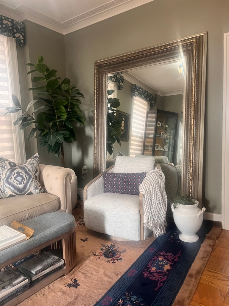 Living room with ornate mirror and patterned rug